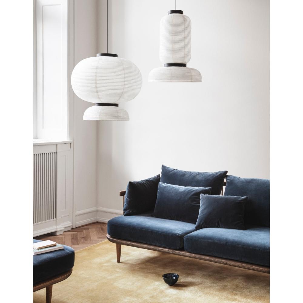 And Tradition JH3 and JH5 Formakami Pendant Lights in room with Fly Sofa by Space Copenhagen