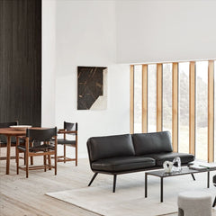 Fredericia Spanish Dining Armchairs BM 3828 by Borge Mogensen Smoked Oak and Black Saddle Leather in living room with Spine Sofa
