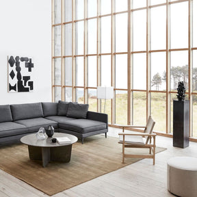 Fredericia Canvas Chair in living room with wall of windows and artwork