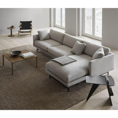 Fredericia Jens Risom Magazine Table in room with Calmo sectional sofa and Piloti coffee table.