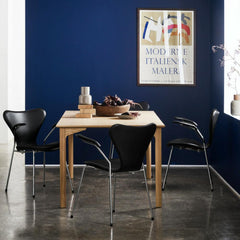 Grand Prix Table in room with leather Series 7 Chairs by Arne Jacobsen for Fritz Hansen
