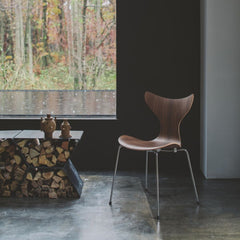 Fritz Hansen Lily Chair 3108 in room with firewood