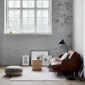 Fritz Hansen Cecilie Manz Pouf in room with Leather Lune Sofa