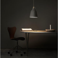 Fritz Hansen Cecilie Manz Caravaggio Pendant Light in home office with Super Elliptical Table and Series 7 Chair
