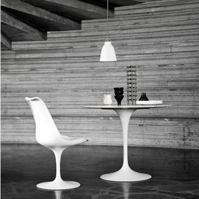 Fritz Hansen Cecilie Manz Caravaggio Pendant Light Gloss White in room with Saarinen Tulip Table and Tulip Chair
