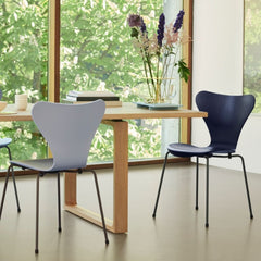 Fritz Hansen Essay Table by Cecilie Manz in room with Series 7 Chairs and Ikebana Vase