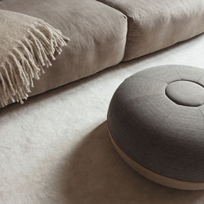 Fritz Hansen Cecilie Manz Pouf Concrete Remix in room with throw