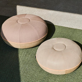 Fritz Hansen Cecilie Manz Poufs in room with Green Wool Rug