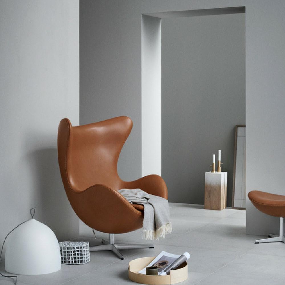 Fritz Hansen Egg Chair in Elegance Leather Walnut in Room with Lightyears Pendant and Objects