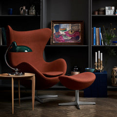 Fritz Hansen Egg Chair in room with Kaiser Idell Luxus Table Lamp and Tray Table