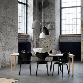 Fritz Hansen Gam Fratesi Suspence Pendants Black White Grey in loft with Grand Prix Chairs and Grand Prix Dining Table