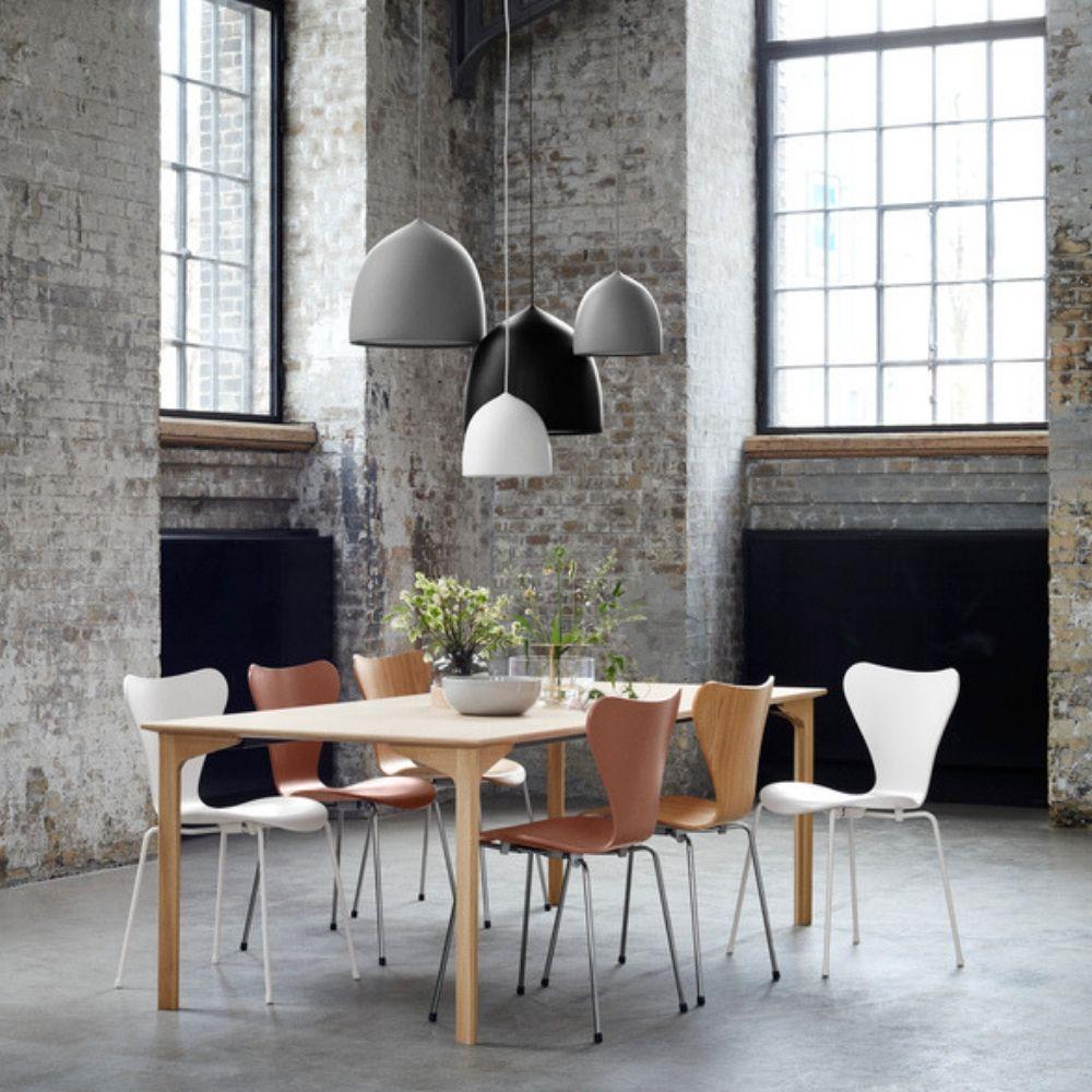 Fritz Hansen Gam Fratesi Suspence Pendants in loft with nude Series 7 chairs and Grand Prix Dining Table