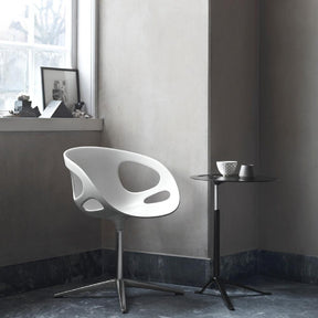 Fritz Hansen Little Friend Table in room with Ro Chair