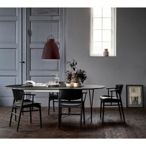 Fritz Hansen Nendo N01 Chairs in room with Caravaggio Pendant Light and Super Elliptical Dining Table
