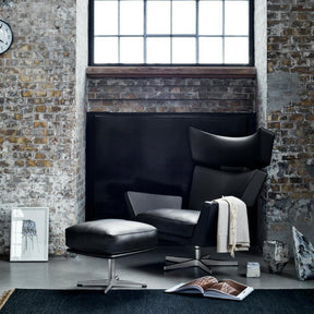 Fritz Hansen Oksen Chair and Ottoman by Arne Jacobsen in Black Leather in Room
