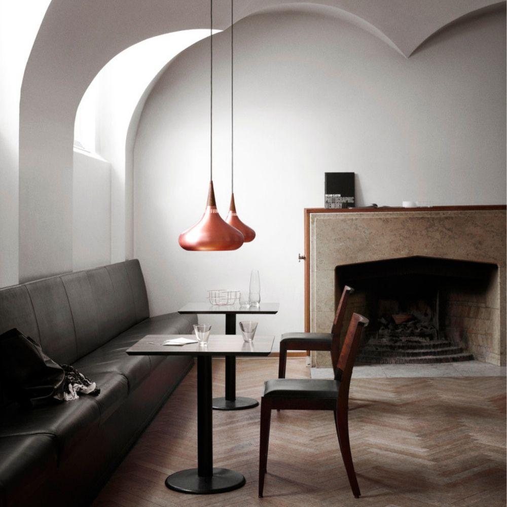 Fritz Hansen Copper Orient Pendant Lights in Cafe with Fireplace