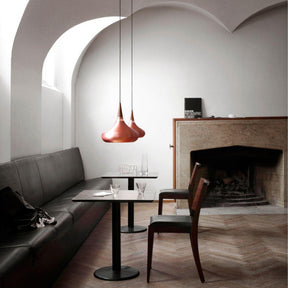 Fritz Hansen Copper Orient Pendant Lights in Cafe with Fireplace