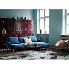 Fritz Hansen Paul McCobb Planner Coffee Table in room with Lune Sofa and Pot Chair