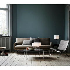 Lissoni Sofa in room with Poul Kjaerholm furniture collection by Fritz Hansen