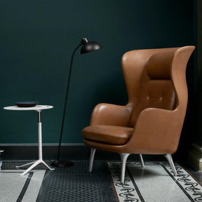 Fritz Hansen Ro Chair Leather in room with Little Friend Table and Kaiser Idell Floor Lamp