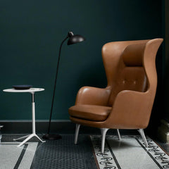 Fritz Hansen Little Friend Table in room with Leather Ro Chair