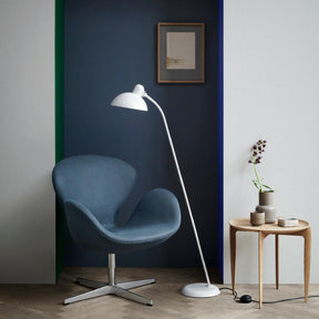 Fritz Hansen Swan Chair Dark Blue in Room with Kaiser Idell Floor Lamp