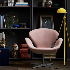 Fritz Hansen Swan Chair in pale pink wool in room with yellow Lightyears Floor Lamp