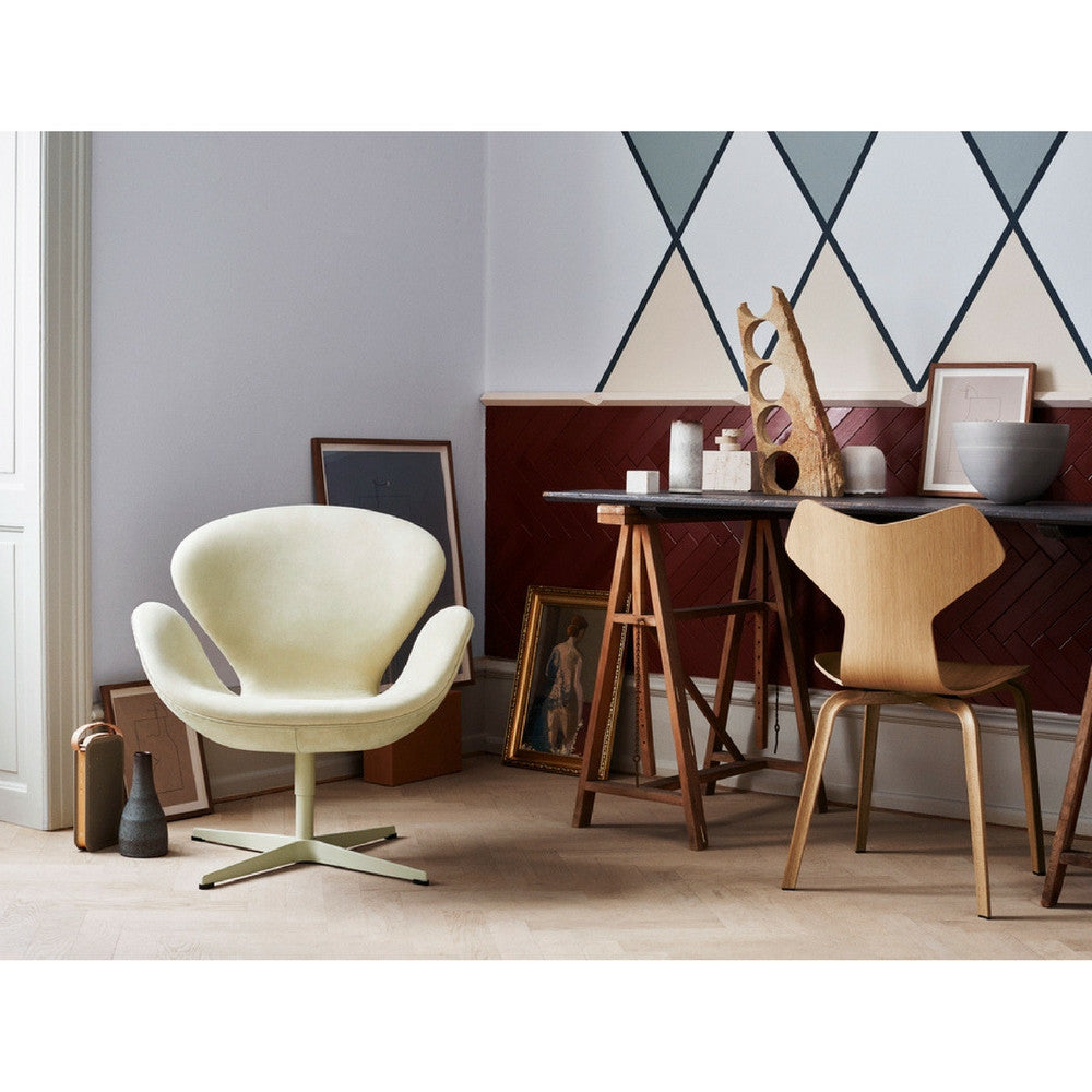 Fritz Hansen Swan Chair in room with Grand Prix Chair