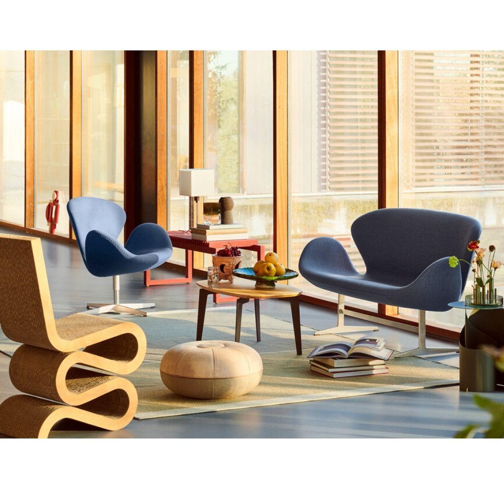 Fritz Hansen Limited Edition Pouf in room with Swan Sofa and Wiggle Chair
