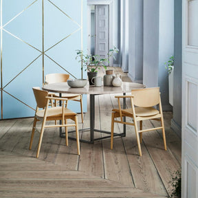 Fritz Hansen Nendo N01 Dining Chairs in Room with round marble Poul Kjaerholm Table