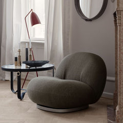 GUBI Adnet Coffee Table in room with Pacha Lounge chair and Grasshopper Lamp