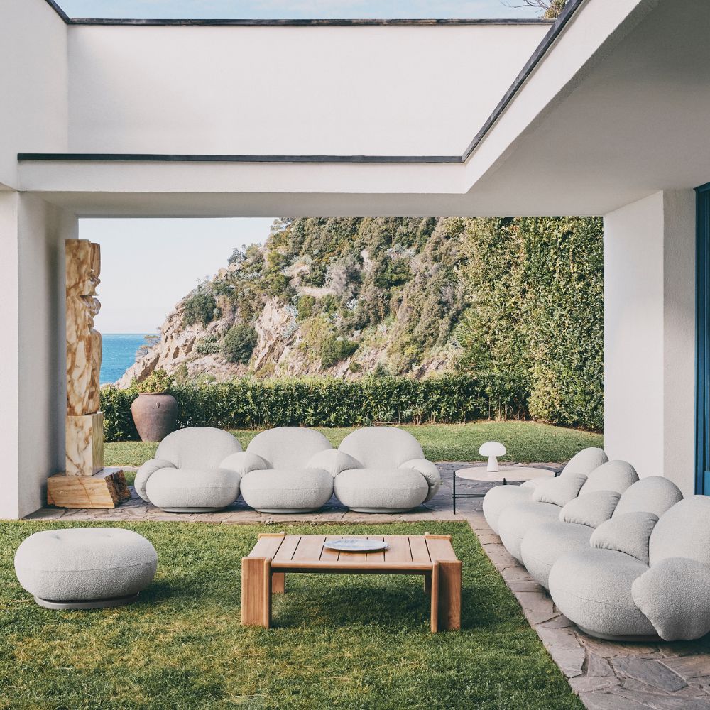 GUBI Atmosfera Outdoor Coffee Table with the Pacha Outdoor Collection by Pierre Paulin, TS Outdoor Coffee Table by GamFratesi, and Obello Table Lamp by Bill Curry