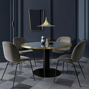 Gubi Brass Semi Pendant in Room with Grey Velvet Beetle Chairs