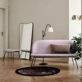 GUBI Gio Ponti F.A.33 Mirror Blackened Brass in room with Beetle Sofa and Bestlite Floor Lamp