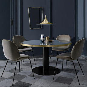 GUBI Gio Ponti F.A.-33 Wall Mirror in room with Semi Pendant and Beetle Dining Chairs