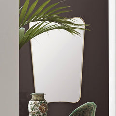 GUBI Gio Ponti F.A.-33 Wall Mirror in situ with plant