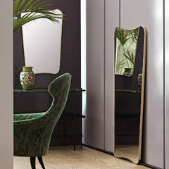 GUBI Gio Ponti F.A.-33 Wall Mirrors in room with Eva Lounge Chair