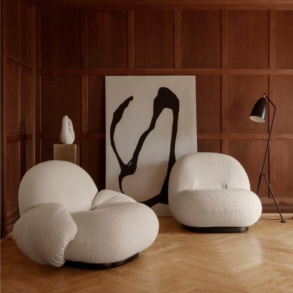 GUBI Grasshopper Floor Lamp by Greta Grossman in room with Pacha Lounge Chairs