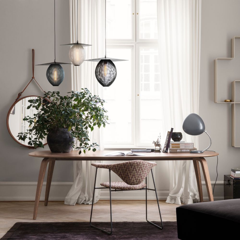 GUBI Satellite Pendants in Home Office with Ellipse Talbe and Masculo Chair