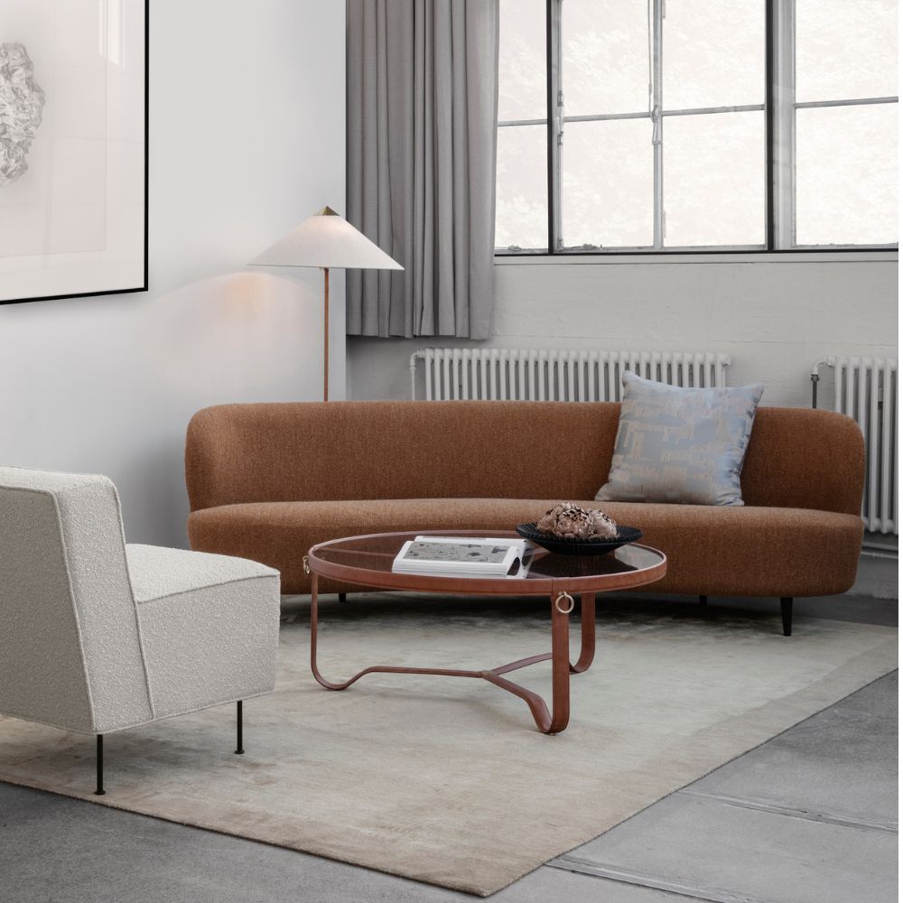 Gubi Paavo Tynell 9602 Floor Lamp in loft with Stay Sofa, Modern Line Sofa, and Adnet Coffee Table