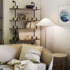 GUBI Paavo Tynell 9602 Floor Lamp in living room with Mategot Shelves, Revers Sofa, and TS Side Table