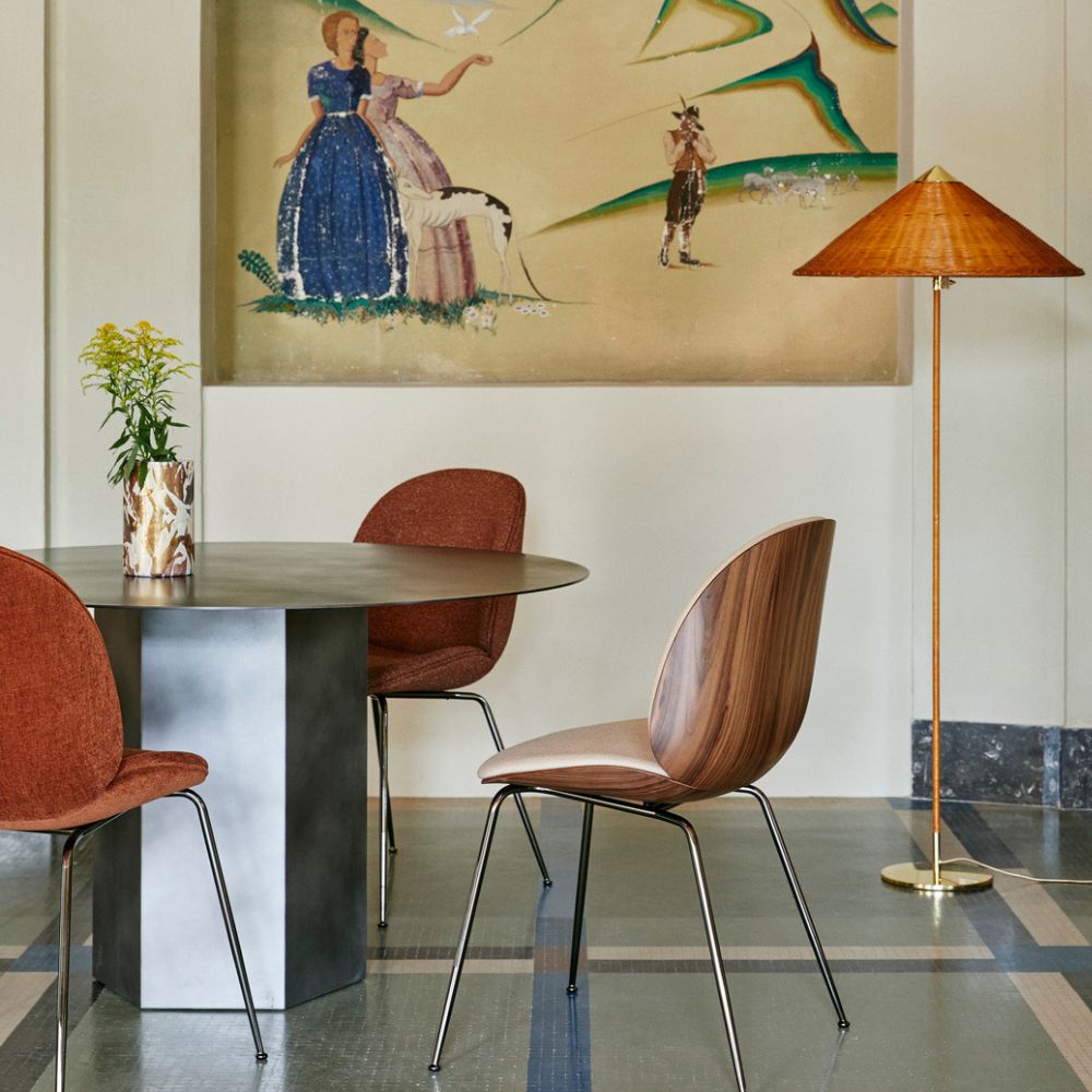 GUBI Paavo Tynell 9602 Floor Lamp in room with Beetle Chairs and Epic Dining Table