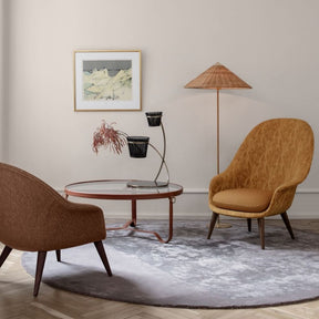 Gubi 9602 Floor Lamp with Wicker Willow Shade in room with Bat Lounge Chairs and Adnet Coffee Table