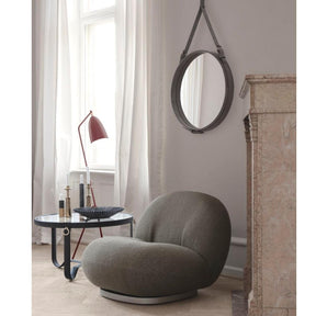 GUBI Pacha Lounge Chair by Pierre Paulin in room with Adnet Mirror and Grasshopper Lamp