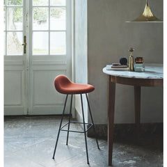 Gubi Semi Pendant in Brass in room with marble table and 3D Stool by Komplot Design