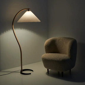 GUBI Timberline Floor Lamp by Mads Caprani in room with Stay Lounge Chair