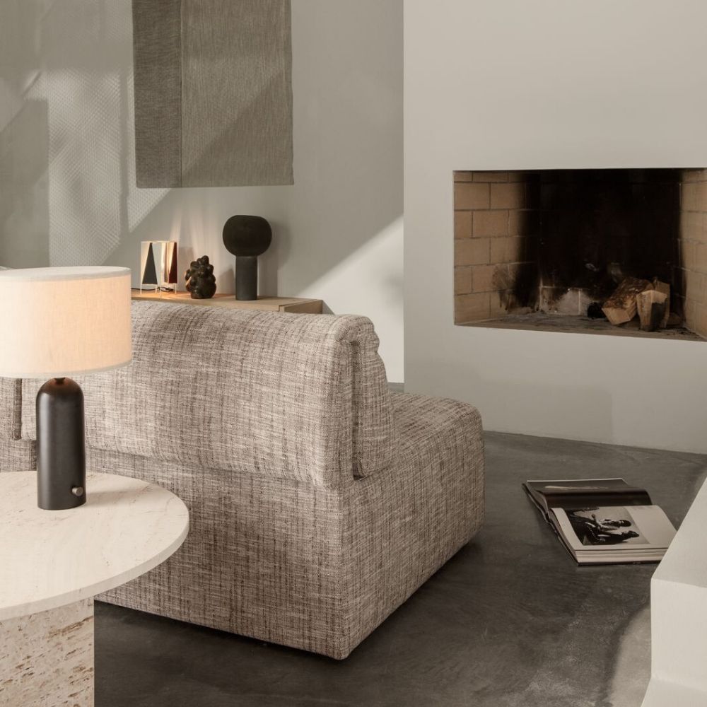 GUBI Wonder Sofa by Space Copenhagen in room with fireplace
