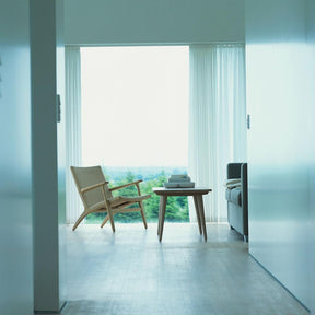 Wegner CH25 Lounge Chair in Oak White Oil in room with CH008