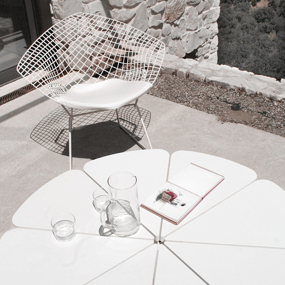 Harry Bertoia Diamond Chair with White Cushion Outdoors with Petal Table Knoll