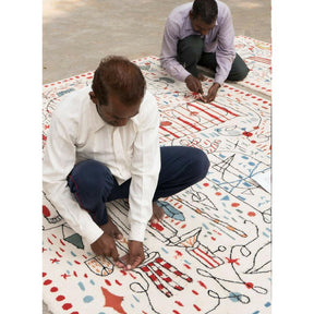 Nani Marquina Hayon x Nani Rug being made by two craftsmen